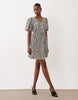 VILA tie waist polka dot mini dress in cream and black