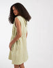 Vero Moda sleeveless bow tie side seersucker mini dress in green gingham print