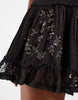 scoop neck mini dress with sheer lace panels and floral embellishment in washed charcoal