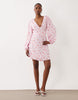 VILA v neck button front long sleeve mini dress in pink floral print