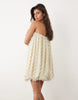 wave textured bubble hem sweetheart neck mini dress in stone