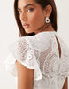 crochet flutter sleeve mini dress in ivory scuba-style fabric