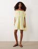 volume puff mini dress in lime plaid print